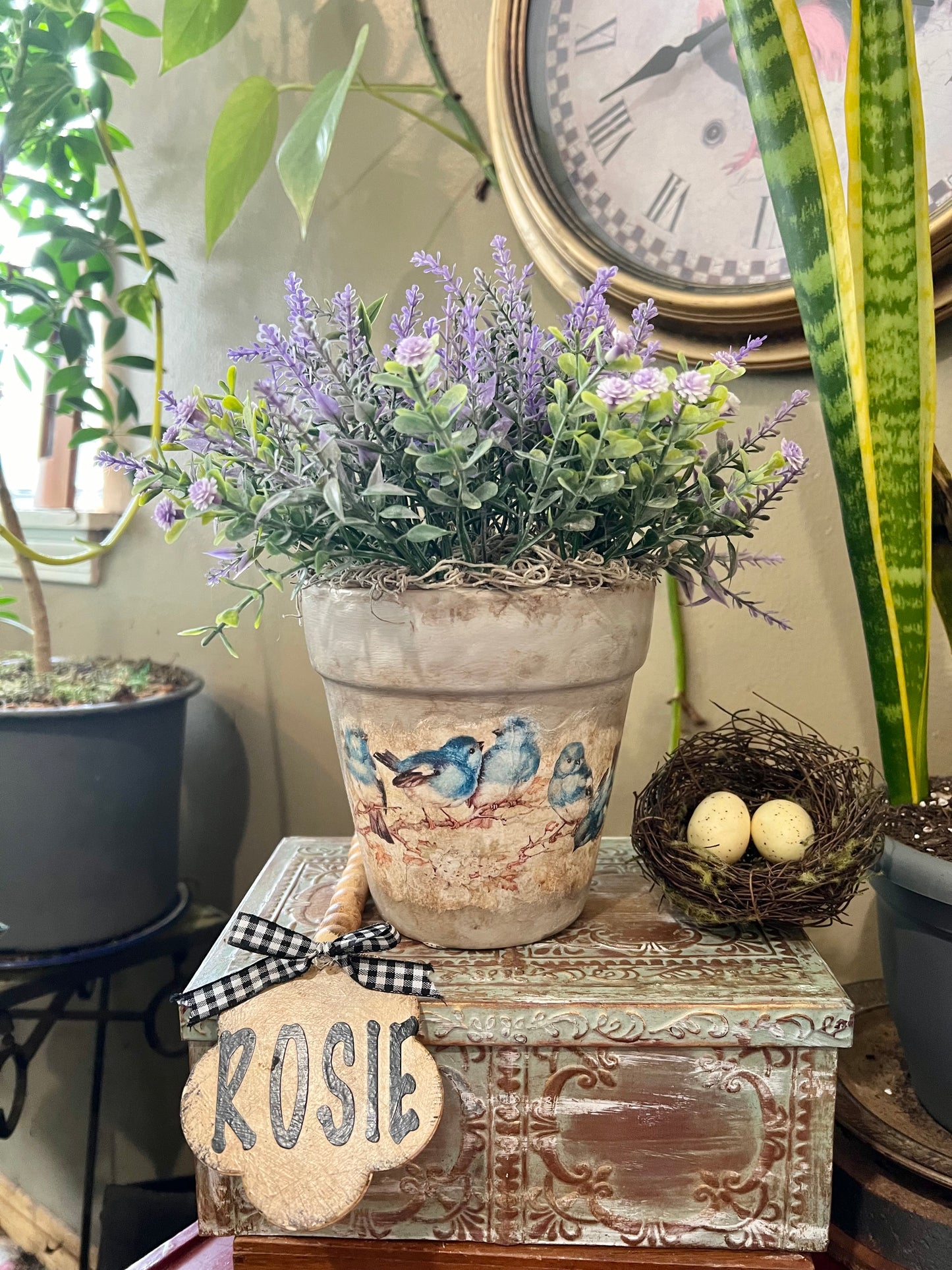 Lavender artificial flower plant in terra cotta pot