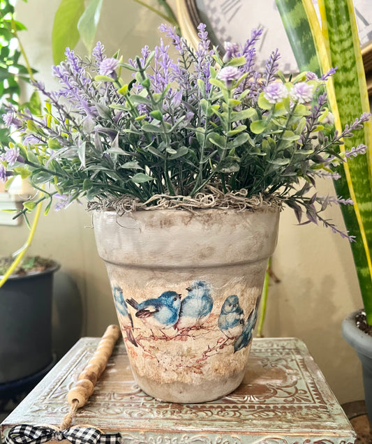 Lavender artificial flower plant in terra cotta pot